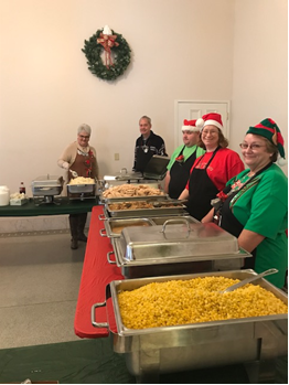 LogistiCare Norton Managers Serving Food