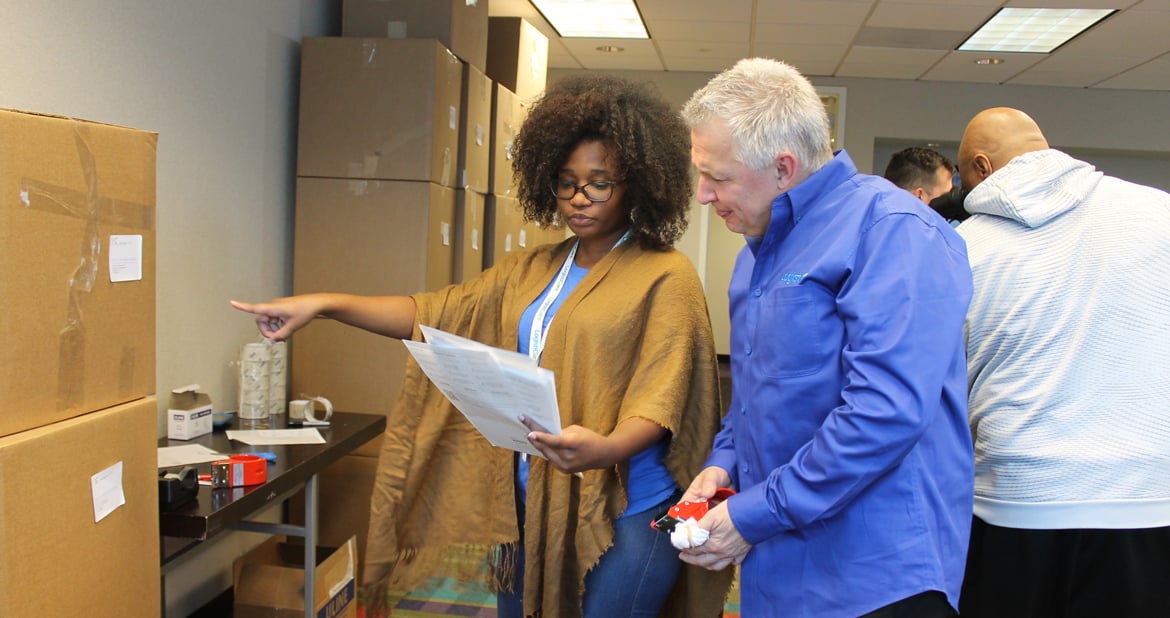 LogistiCare employees preparing care packages